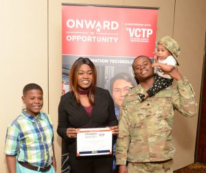 Onward to opportunity graduate Moore standing with his family.