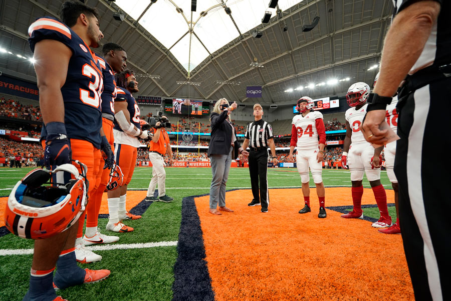 Maureen Casey doing the coin toss for the SU football game at the Dome on 9/11.