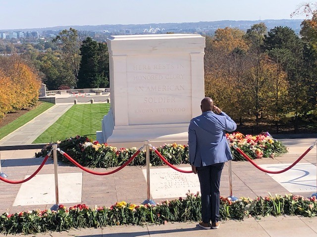 Bart Womack saluting at tomb of unknown soldier 