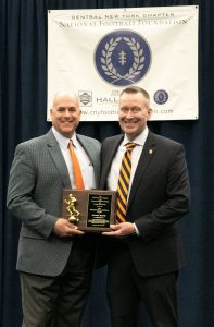 Mike Hyanie receiving award from National Football Foundation