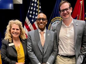 Kathryn Warren and John Nipper, right, are pictured with the Hon. Donald M. Remy, deputy secretary of veterans affairs.