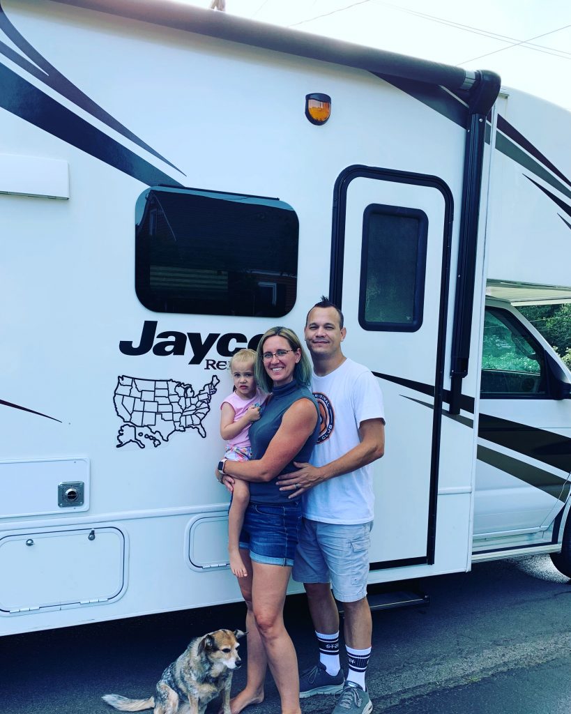 Kristen and her family in front of their RV