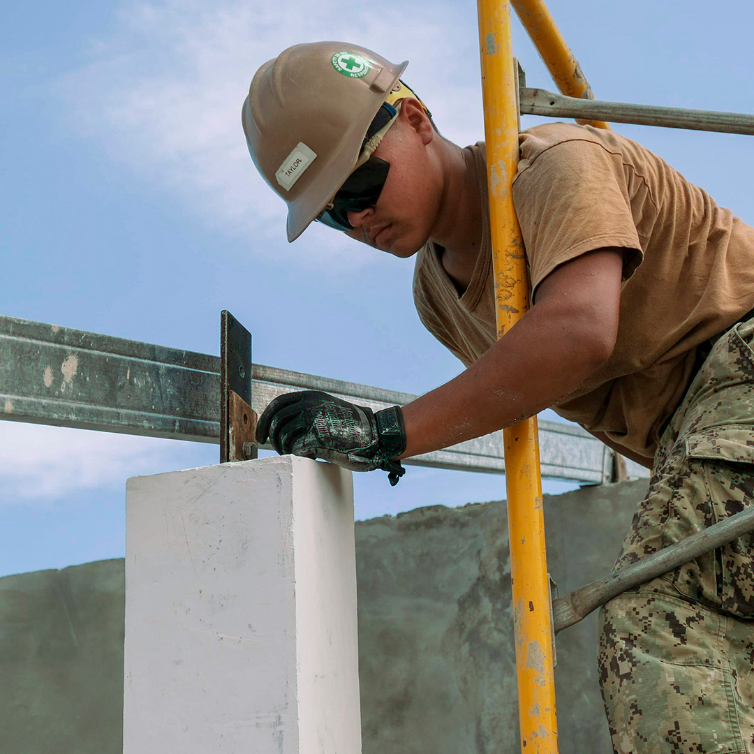 Soldier working at construction site.