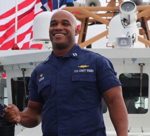 Joshua Tucker on ship during Coast guard service.