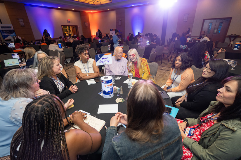 Neale Godfrey at VWISE assisting participants during mentor roundtable.