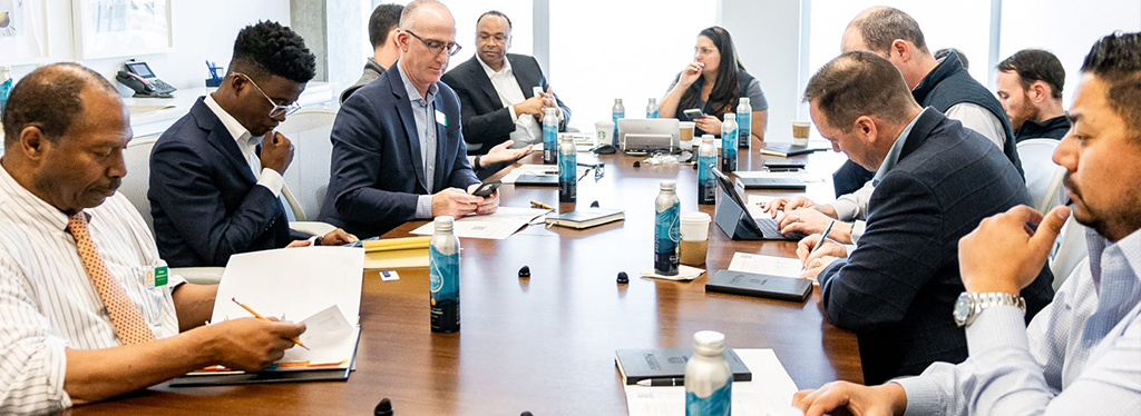 CEOcircle participants in a meeting around a table.