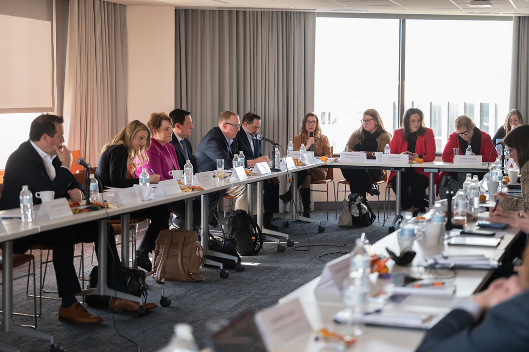 People discussing veteran and business issues at the walmart roundtable.