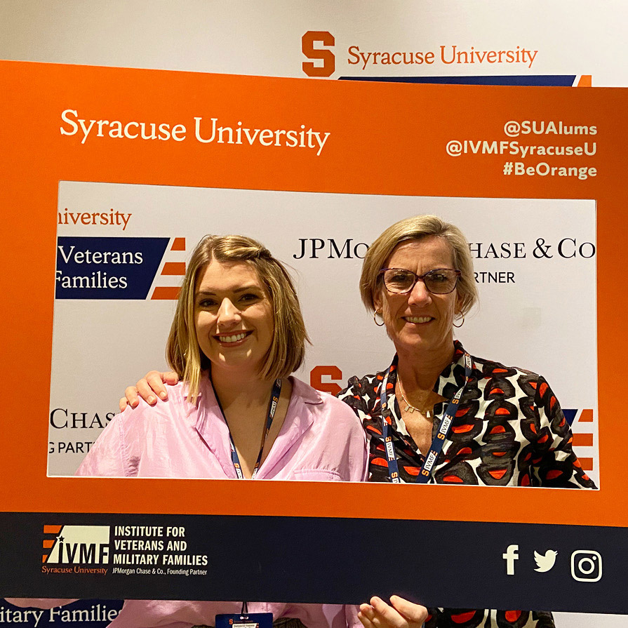 Kathleen and Alaina in a photo frame at IVMF event