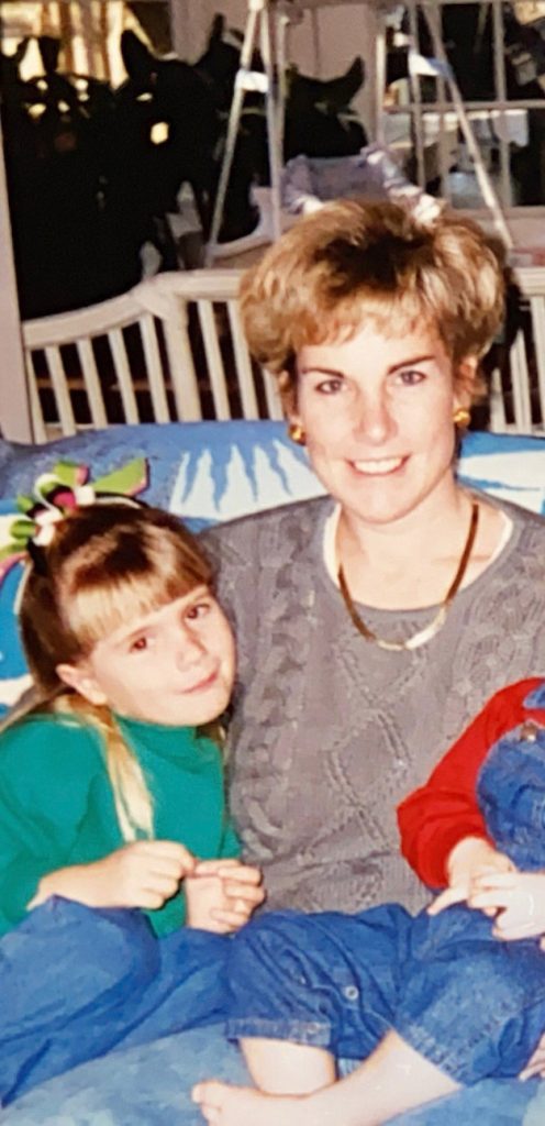 Kathleen with a young Alaina on her lap