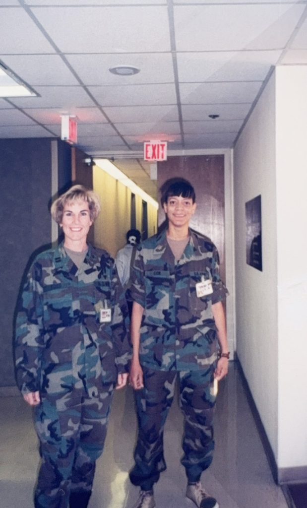 Kathleen in uniform posing with fellow army soldier.