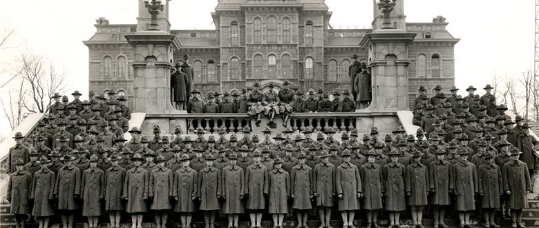 Syracuse University Army Training Corps posing in front of the Hall of Languages, 1918