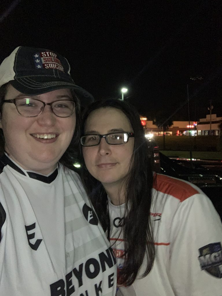 Belverly Cutchins with partner wearing jersey