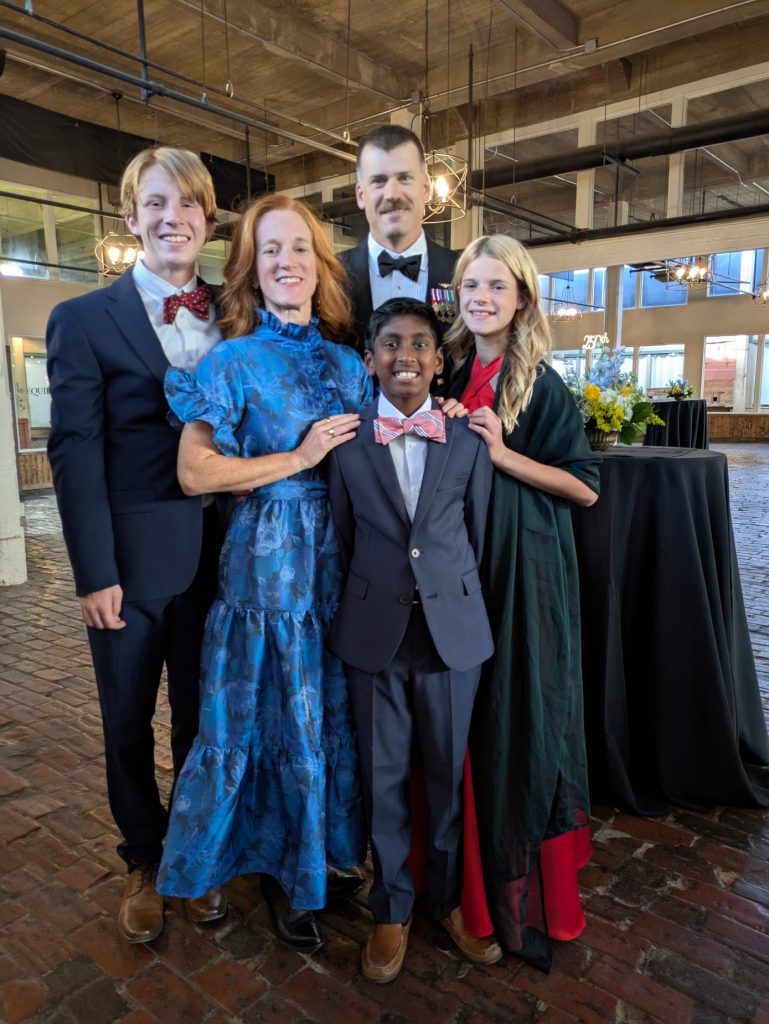 Kate johnson and her family dressed up attending an event.