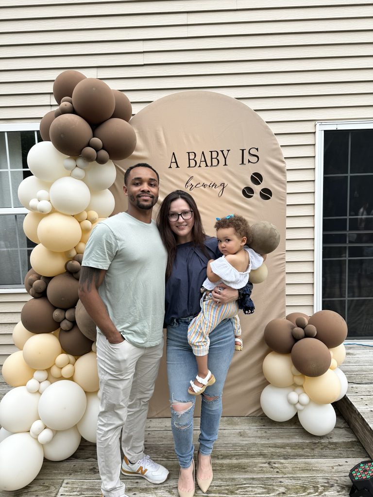 Sabina Lyszczarczyk with her family for a pregnancy announcement